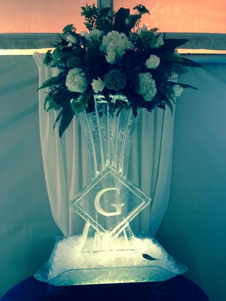 Chef Dave created this custom vase ice sculpture to enhance the flowers for the event creating a stunning centerpiece. Let us enhance your event, call us today. 